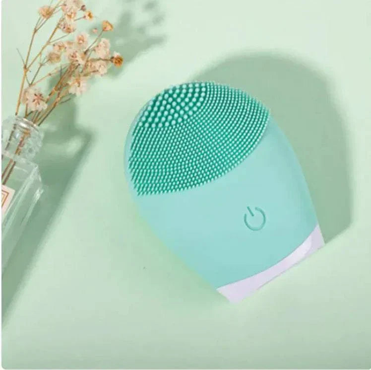 Ultrasonic silicone facial cleansing brush in green color, electric skin care device for deep cleansing.