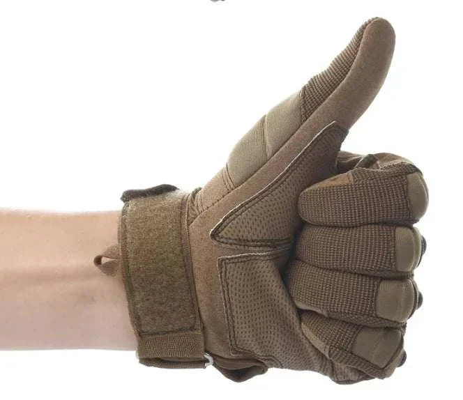 Tactical carbon fiber knuckle gloves with adjustable wrist strap showing thumbs up gesture.